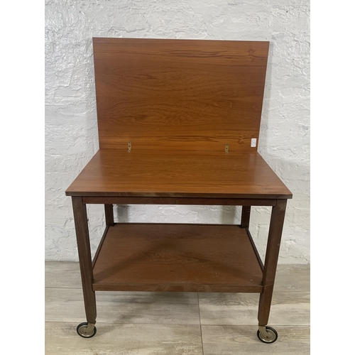 2 - A mid 20th century teak fold out two tier cocktail trolley - approx. 63cm high x 70cm wide x 90cm lo... 