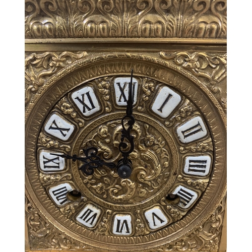 21 - A French style brass cased chiming mantel clock with winder - approx. 20cm high x 15cm wide x 11cm d... 