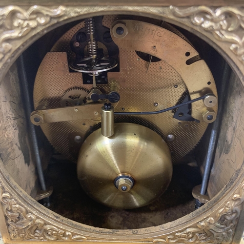 21 - A French style brass cased chiming mantel clock with winder - approx. 20cm high x 15cm wide x 11cm d... 