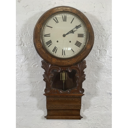 26 - A late 19th/early 20th century American inlaid walnut cased drop dial wall clock with winder and pen... 