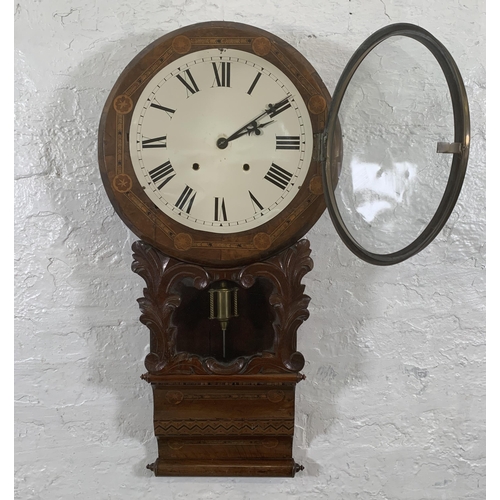 26 - A late 19th/early 20th century American inlaid walnut cased drop dial wall clock with winder and pen... 