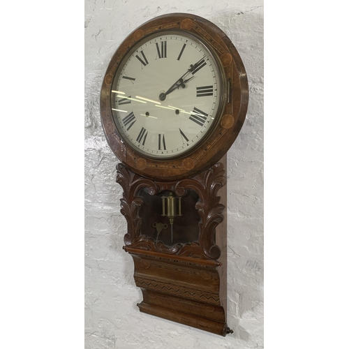 26 - A late 19th/early 20th century American inlaid walnut cased drop dial wall clock with winder and pen... 