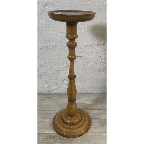 27 - Two pieces of oak furniture, one mid 20th century circular top jardinière stand - approx. 67cm high ... 