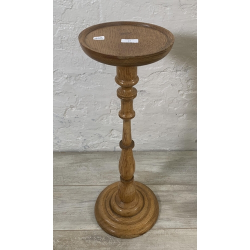 27 - Two pieces of oak furniture, one mid 20th century circular top jardinière stand - approx. 67cm high ... 