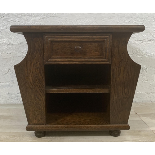 29 - An oak magazine rack side table - approx. 47cm high x 50cm wide x 45cm deep