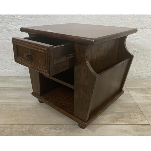 29 - An oak magazine rack side table - approx. 47cm high x 50cm wide x 45cm deep