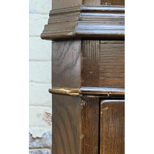 30 - A Jaycee carved oak free standing corner cabinet - approx. 185cm high