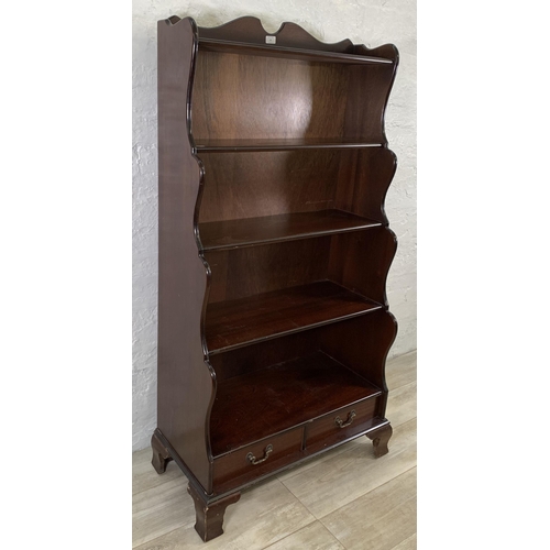 33 - A Georgian style mahogany five tier waterfall bookcase - approx. 152cm high x 80cm wide x 49cm deep