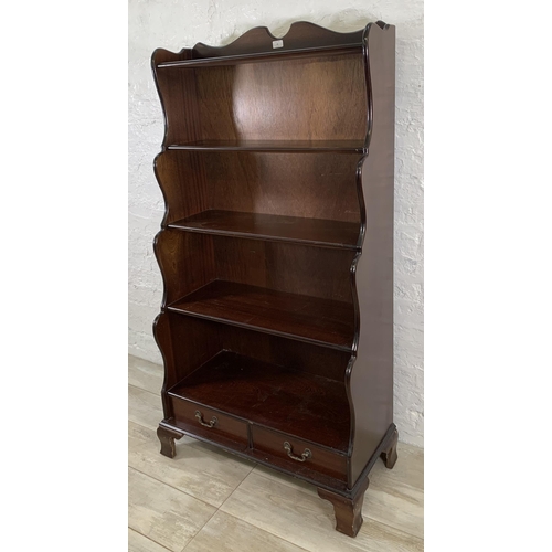 33 - A Georgian style mahogany five tier waterfall bookcase - approx. 152cm high x 80cm wide x 49cm deep