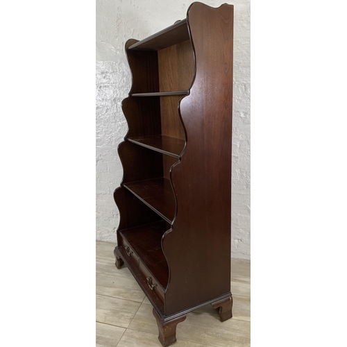 33 - A Georgian style mahogany five tier waterfall bookcase - approx. 152cm high x 80cm wide x 49cm deep