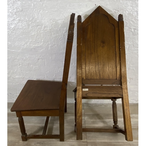 38 - A pair of Gothic style carved oak ecclesiastical type dining/hall chairs with reeded supports and 