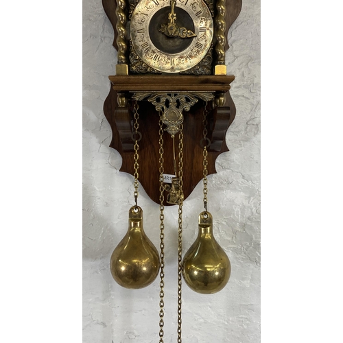 39 - A Dutch Zaanse brass and mahogany double weight wall clock - approx. 51cm high