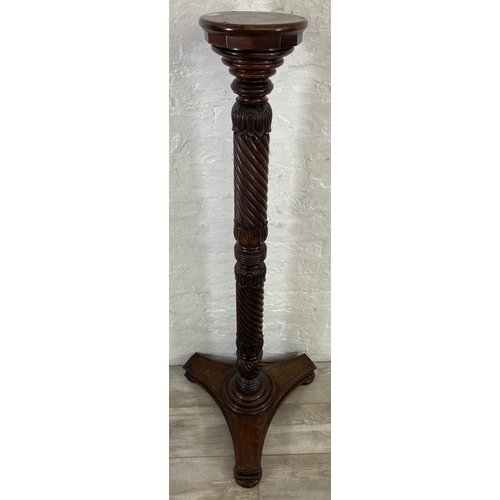 40 - An early/mid 19th century carved mahogany circular top torchere on tripod pedestal support - approx.... 