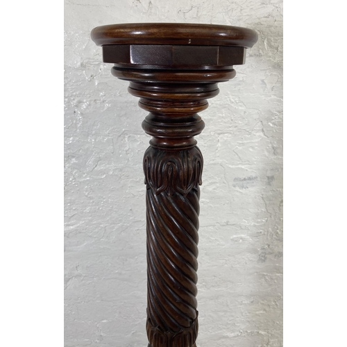 40 - An early/mid 19th century carved mahogany circular top torchere on tripod pedestal support - approx.... 