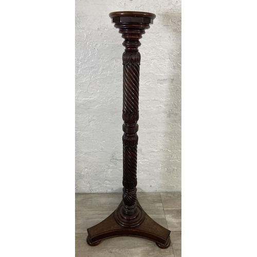 40 - An early/mid 19th century carved mahogany circular top torchere on tripod pedestal support - approx.... 