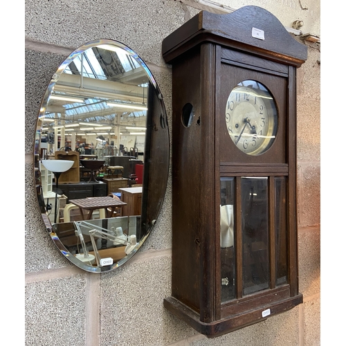 41 - Two items, one early/mid 20th century oak cased chiming wall clock with pendulum and winder - approx... 