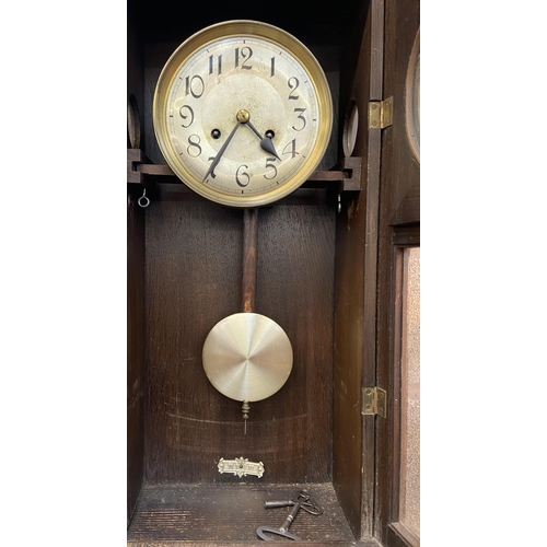 41 - Two items, one early/mid 20th century oak cased chiming wall clock with pendulum and winder - approx... 