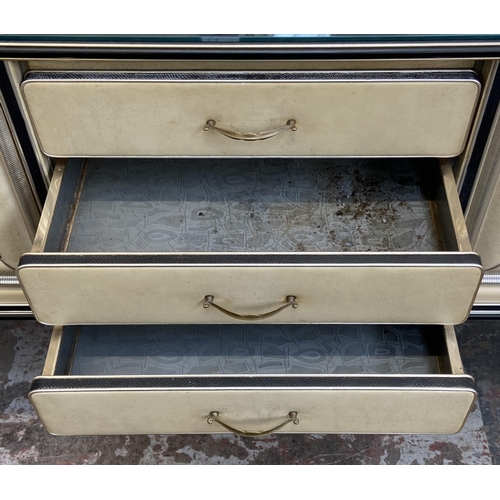 43 - A 1950s Italian Umberto Mascagni ebonised and faux leather chinoiserie dressing table on tapering su... 