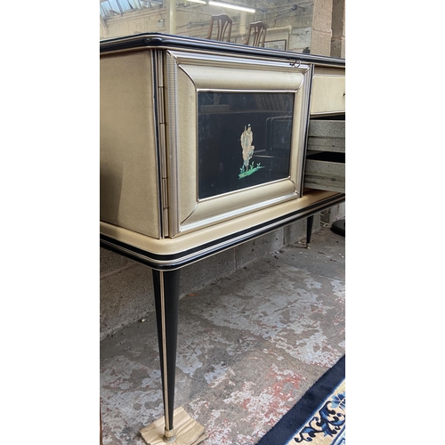 43 - A 1950s Italian Umberto Mascagni ebonised and faux leather chinoiserie dressing table on tapering su... 