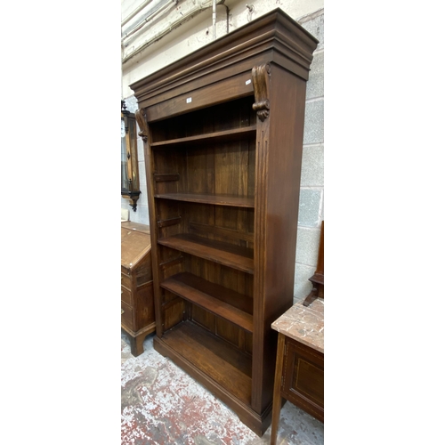 48 - A 19th century style carved hardwood five tier bookcase - approx. 210cm high x 112cm wide x 40cm dee... 