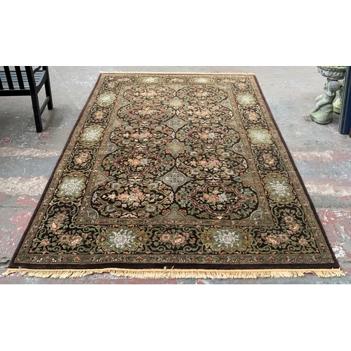 5 - An Eastern Kayam OCM Kaimuri brown ground floral pattern rug - approx. 300cm x 200cm