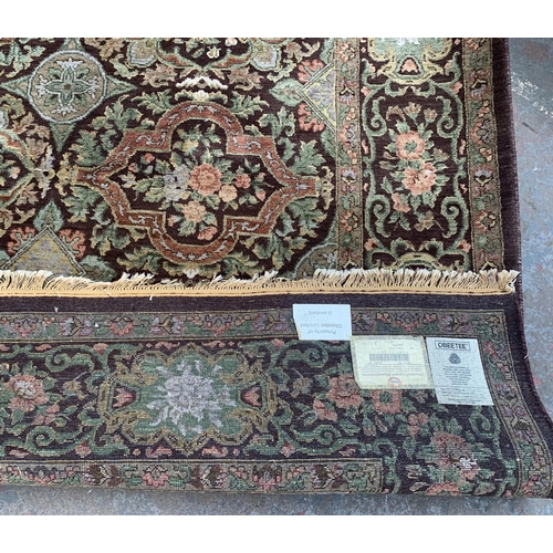 5 - An Eastern Kayam OCM Kaimuri brown ground floral pattern rug - approx. 300cm x 200cm