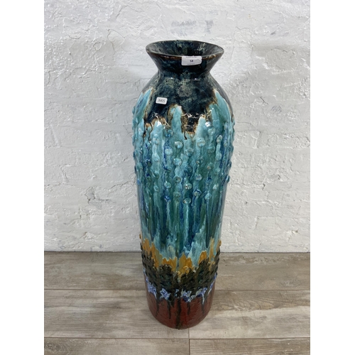 58 - A large drip glazed ceramic floor vase - approx. 97cm high