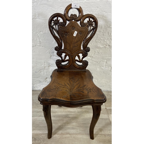 60 - A late 19th century Black Forest carved walnut musical hall chair - approx. 68cm high x 32cm wide x ... 