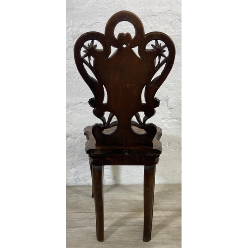 60 - A late 19th century Black Forest carved walnut musical hall chair - approx. 68cm high x 32cm wide x ... 