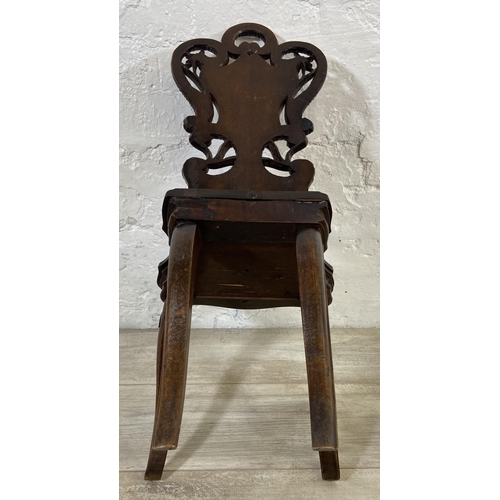 60 - A late 19th century Black Forest carved walnut musical hall chair - approx. 68cm high x 32cm wide x ... 