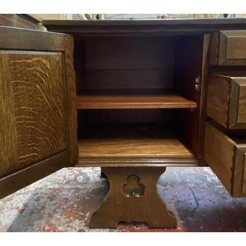 62 - A Gothic style carved oak dressing table - approx. 74cm high x 152cm wide x 45cm deep