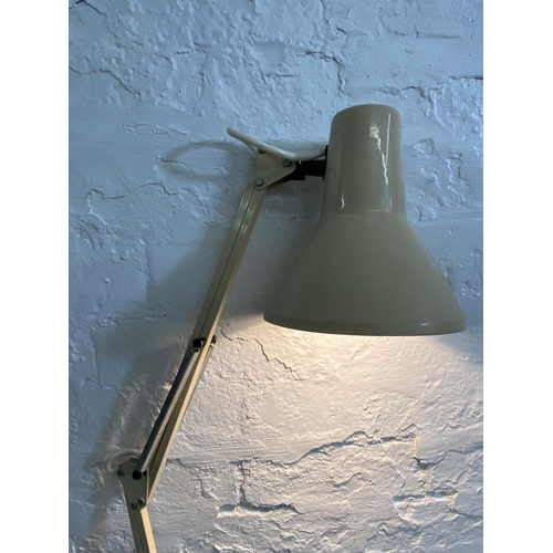 63 - Two mid 20th century articulated desk lamps, one Mek-Elek London and one Emmedi