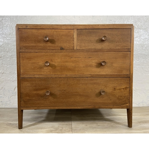 64 - A George VI Heals style oak chest of drawers - approx. 82cm high x 91cm wide x 50cm deep