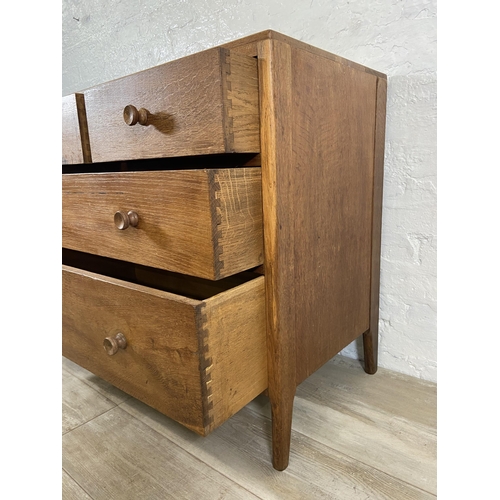 64 - A George VI Heals style oak chest of drawers - approx. 82cm high x 91cm wide x 50cm deep