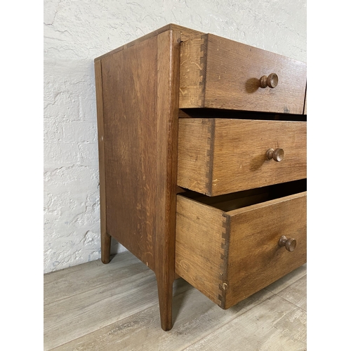 64 - A George VI Heals style oak chest of drawers - approx. 82cm high x 91cm wide x 50cm deep