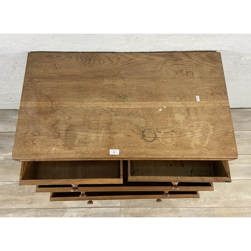 64 - A George VI Heals style oak chest of drawers - approx. 82cm high x 91cm wide x 50cm deep