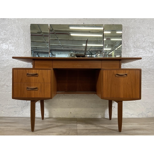 66 - A mid 20th century G Plan teak dressing table - approx. 120cm high including mirror x 127cm wide x 4... 