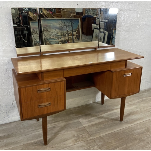 66 - A mid 20th century G Plan teak dressing table - approx. 120cm high including mirror x 127cm wide x 4... 