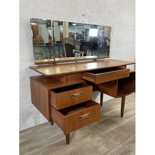 66 - A mid 20th century G Plan teak dressing table - approx. 120cm high including mirror x 127cm wide x 4... 