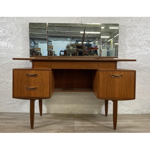 66 - A mid 20th century G Plan teak dressing table - approx. 120cm high including mirror x 127cm wide x 4... 