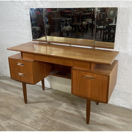 66 - A mid 20th century G Plan teak dressing table - approx. 120cm high including mirror x 127cm wide x 4... 