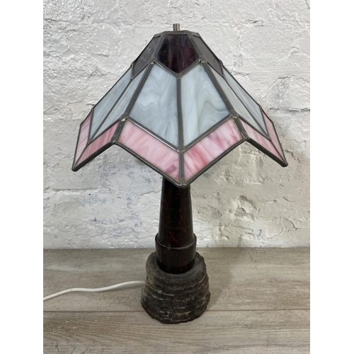 69 - A Tiffany style marble column table lamp on stone base with stained glass shade - approx. 47cm high