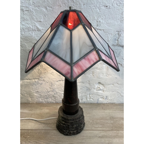 69 - A Tiffany style marble column table lamp on stone base with stained glass shade - approx. 47cm high