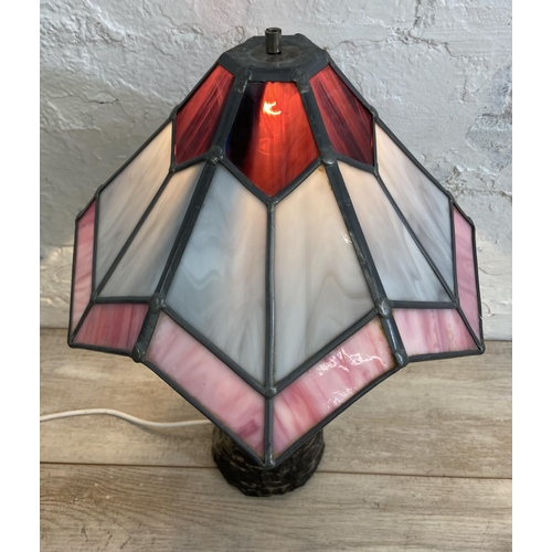 69 - A Tiffany style marble column table lamp on stone base with stained glass shade - approx. 47cm high