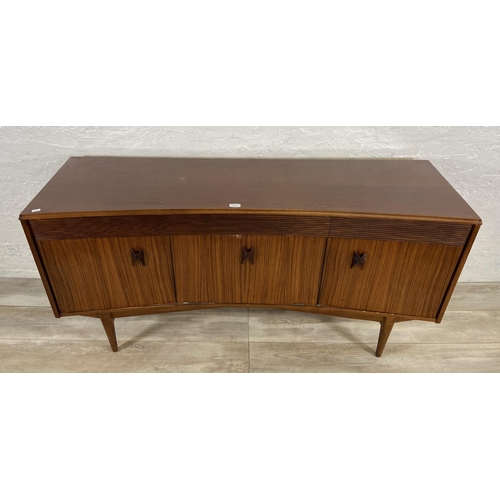 71 - A mid 20th century Elliotts of Newbury zebrano and teak concaved sideboard - approx. 76cm high x 150... 