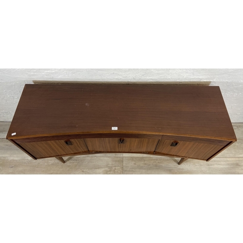 71 - A mid 20th century Elliotts of Newbury zebrano and teak concaved sideboard - approx. 76cm high x 150... 