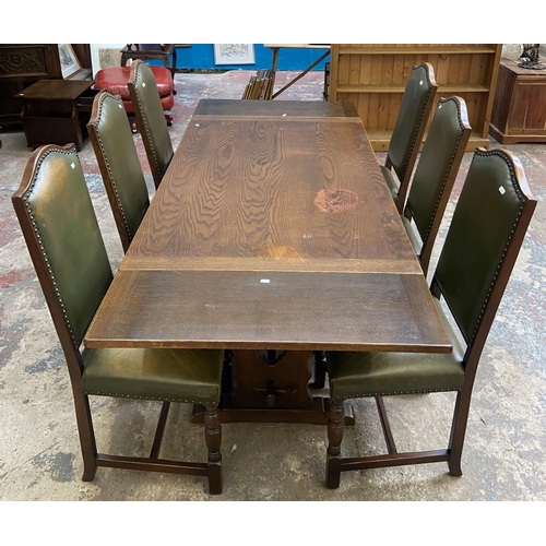 75 - A 17th century style oak rectangular refectory dining table and six green vinyl upholstered dining c... 