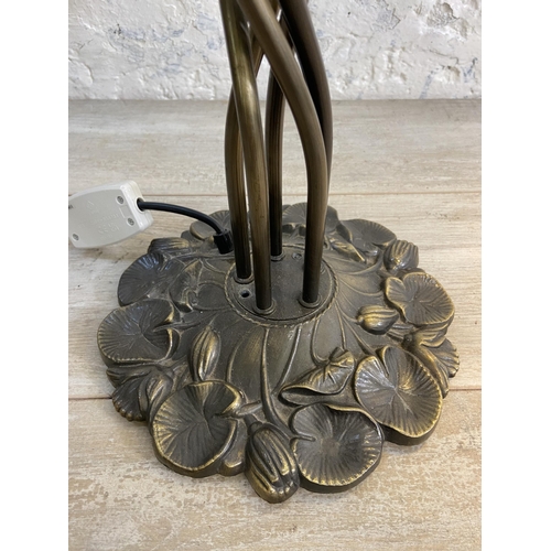 81 - An Art Nouveau style bronzed lily pad table lamp with five green and yellow mottled glass shades - a... 