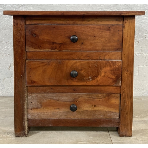 84 - An Indian sheesham wood bedside chest of drawers - approx. 60cm high x 60cm wide x 40cm deep