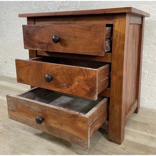 84 - An Indian sheesham wood bedside chest of drawers - approx. 60cm high x 60cm wide x 40cm deep